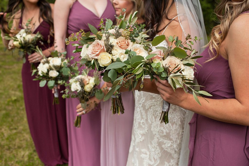 wine colored dresses with pink bouquets