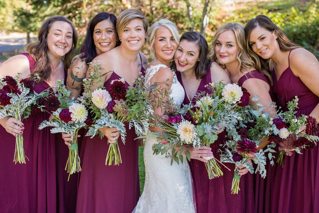 bride with bridesmaids in wine colored dresses