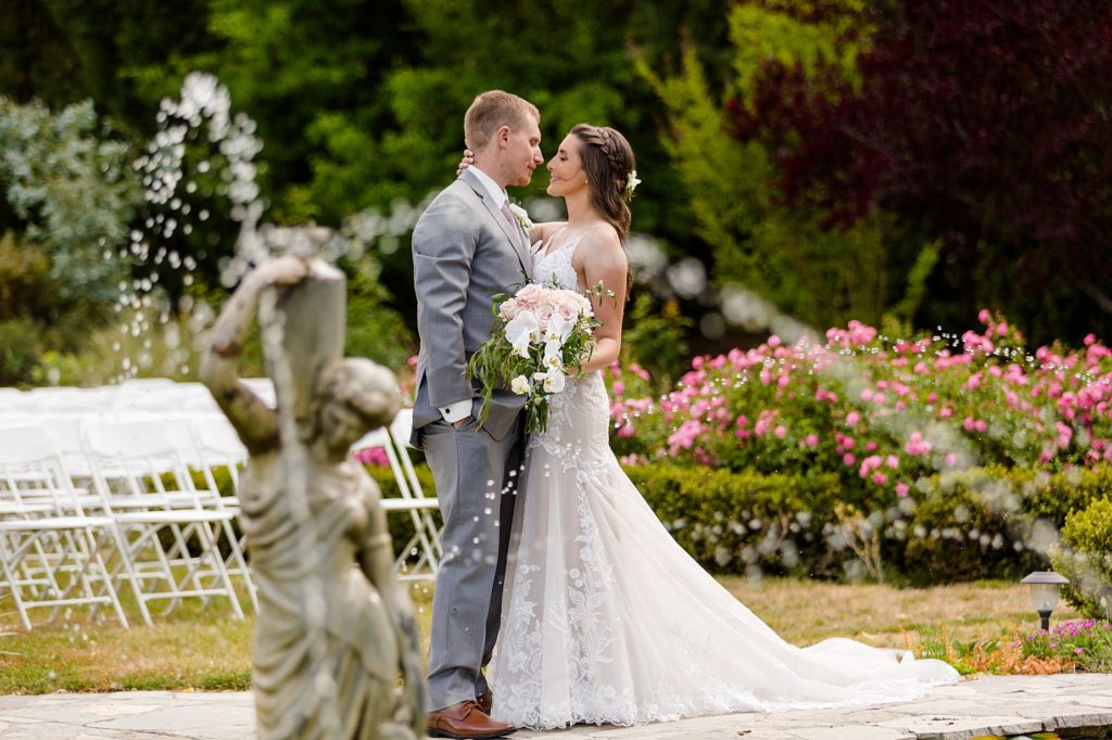 bride and groom with fountain