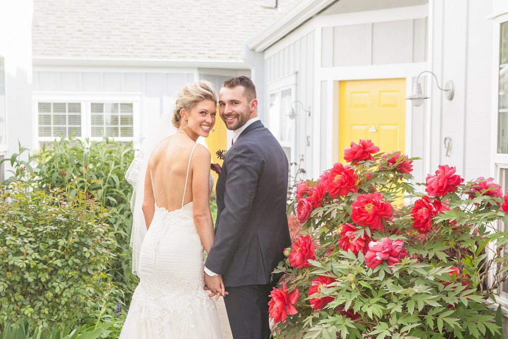 bride and groom in flower garden