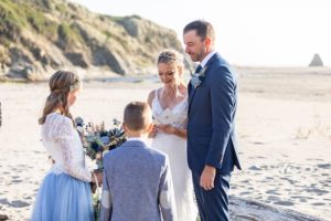 bride reading wedding vows to step children