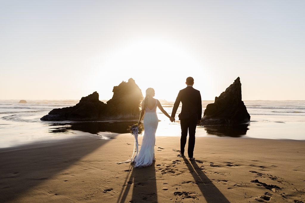 sunset on the beach with newlyweds