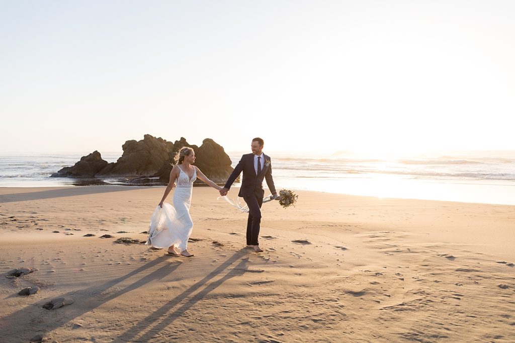 Newlyweds walking on the sandy beach