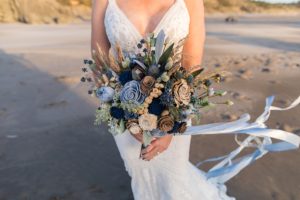 bride with blue wooden bouquet