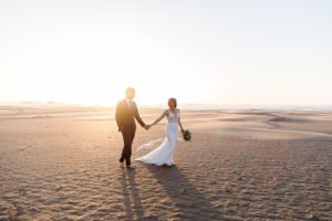dreamy sunset on the beach with newlyweds