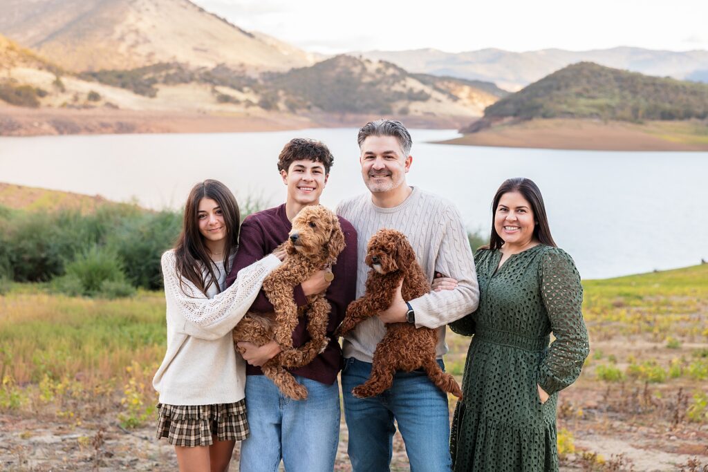 family photo with their two doodle dogs